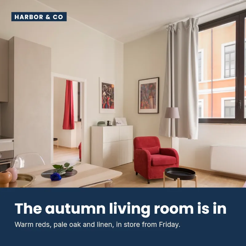 Generated social post with a photo of a bright living room with a red armchair, and a navy band below reading 'The autumn living room is in'.